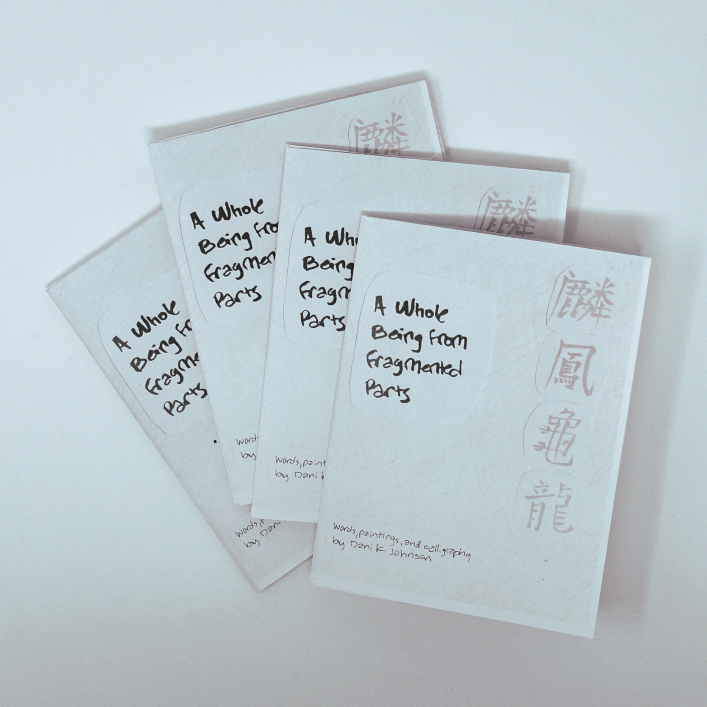 pile of four example printed zines